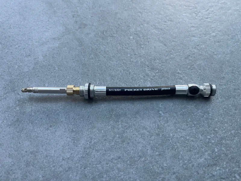 The assembled adapter: the left side connects to the pump, the right side threads into the TPU valve stem.
